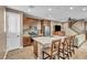 Well-lit kitchen featuring stainless steel appliances, eat-in island, and hardwood floors at 500 Pear Lake St, Las Vegas, NV 89138