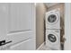 Convenient laundry room featuring stacked washer and dryer at 500 Pear Lake St, Las Vegas, NV 89138