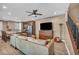 Cozy living room featuring ceiling fan, hardwood floors and comfortable seating at 500 Pear Lake St, Las Vegas, NV 89138