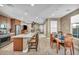 Spacious living space connecting dining, kitchen and living room with hardwood floors and neutral color palette at 500 Pear Lake St, Las Vegas, NV 89138