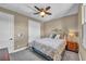 Comfortable bedroom with a ceiling fan, carpet floors, and neutral color palette at 500 Pear Lake St, Las Vegas, NV 89138