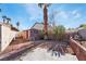 Backyard featuring gravel landscaping, privacy walls, shed, and mature trees at 5111 Rudy Ln, Las Vegas, NV 89120