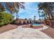 Backyard view showcasing the pool, mature trees, and property exterior at 5111 Rudy Ln, Las Vegas, NV 89120