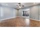 A bedroom featuring tile floors, ceiling fan, and a sliding glass door to the patio at 5111 Rudy Ln, Las Vegas, NV 89120