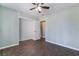 Cozy bedroom with tile flooring, a ceiling fan, and ample closet space at 5111 Rudy Ln, Las Vegas, NV 89120