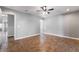 A spacious bedroom featuring tile floors, ceiling fan, and neutral paint color at 5111 Rudy Ln, Las Vegas, NV 89120