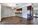 Bright dining room with a breakfast bar and tile flooring, perfect for entertaining guests at 5111 Rudy Ln, Las Vegas, NV 89120