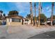 Charming single-story home featuring stone accents, desert landscaping, and a spacious driveway at 5111 Rudy Ln, Las Vegas, NV 89120