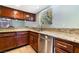 Kitchen featuring granite countertops, stainless steel appliances, and cherry wood cabinetry at 5111 Rudy Ln, Las Vegas, NV 89120