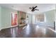 Bright living room featuring a fireplace, ceiling fan, and tile floors at 5111 Rudy Ln, Las Vegas, NV 89120