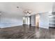 Spacious living room featuring wood-look flooring, a ceiling fan, and neutral paint at 5111 Rudy Ln, Las Vegas, NV 89120