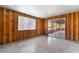 A wood paneled enclosed patio featuring a sliding door entrance and window at 5111 Rudy Ln, Las Vegas, NV 89120