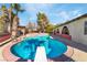 Inviting backyard pool surrounded by trees and desert landscaping at 5111 Rudy Ln, Las Vegas, NV 89120