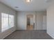 Bright bedroom with neutral carpet, gray walls, and natural light at 5596 Danforth Ave, Las Vegas, NV 89141