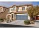 Charming two-story home with a two-car garage and neutral color palette at 5596 Danforth Ave, Las Vegas, NV 89141