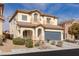 Inviting two-story home with a two-car garage and well-manicured front yard at 5596 Danforth Ave, Las Vegas, NV 89141