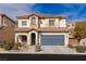 Two-story home featuring a tiled roof, two-car garage, and low-maintenance landscaping at 5596 Danforth Ave, Las Vegas, NV 89141