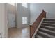 Bright two-story foyer featuring tile flooring, staircase, and natural light at 5596 Danforth Ave, Las Vegas, NV 89141