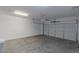 Clean, empty garage with a white door and grey concrete floor at 5596 Danforth Ave, Las Vegas, NV 89141