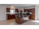 Kitchen with dark cabinets, stainless steel appliances, and a granite-topped island at 5596 Danforth Ave, Las Vegas, NV 89141