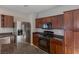 Well-appointed kitchen with dark cabinets and stainless appliances at 5596 Danforth Ave, Las Vegas, NV 89141