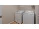 Laundry room equipped with a white washer, dryer, and wire shelving at 5596 Danforth Ave, Las Vegas, NV 89141