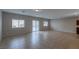 Bright and airy living area featuring tile flooring, neutral walls, and ample natural light at 5596 Danforth Ave, Las Vegas, NV 89141