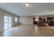 Open-concept living area with tile flooring, recessed lighting, and a view of the kitchen at 5596 Danforth Ave, Las Vegas, NV 89141