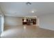 Open living space with tile flooring, recessed lighting, and an adjacent kitchen area at 5596 Danforth Ave, Las Vegas, NV 89141