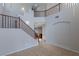 Open-concept living area showcasing a staircase and tile flooring at 5596 Danforth Ave, Las Vegas, NV 89141