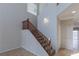 Carpeted staircase with wood railings at 5596 Danforth Ave, Las Vegas, NV 89141