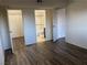 Bedroom featuring wood floors, closet, and an en-suite bathroom at 565 S Royal Crest Cir # 15, Las Vegas, NV 89169