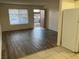 Open-concept living area with hardwood floors, and lots of natural light at 565 S Royal Crest Cir # 15, Las Vegas, NV 89169