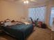 Bright bedroom with a comfortable bed and an exercise bike, offering a space for rest and fitness at 5710 E Tropicana Ave # 1018, Las Vegas, NV 89122