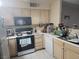 Well-lit kitchen features essential appliances, ample counter space, and functional design for everyday cooking at 5710 E Tropicana Ave # 1018, Las Vegas, NV 89122