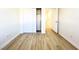 Bright bedroom with wood-look flooring and a closet at 5829 Aqua Verde St, North Las Vegas, NV 89031