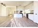 Modern kitchen featuring stainless appliances, an island, and bright white cabinets open to the main living area at 5829 Aqua Verde St, North Las Vegas, NV 89031