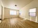 Inviting living room featuring wood-look floors and natural light at 5829 Aqua Verde St, North Las Vegas, NV 89031