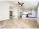 Bright and airy living room featuring stylish flooring and an open floor plan connecting to the kitchen at 5829 Aqua Verde St, North Las Vegas, NV 89031