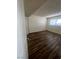 Bedroom features wood-look flooring and a window for natural light at 595 S Royal Crest Cir # 20, Las Vegas, NV 89169