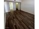 The bedroom features a closet with storage and wood-look flooring at 595 S Royal Crest Cir # 20, Las Vegas, NV 89169