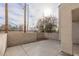 Private backyard patio area with stucco walls and views of trees at 6250 W Flamingo Rd # 7, Las Vegas, NV 89103