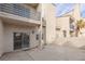 A private backyard patio with a sliding glass door and stucco walls at 6250 W Flamingo Rd # 7, Las Vegas, NV 89103