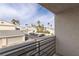 Balcony view shows desert landscaping, palm trees, and parking in a condominium community at 6250 W Flamingo Rd # 7, Las Vegas, NV 89103