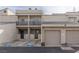 Charming condo building with private parking, garages, and inviting outdoor spaces at 6250 W Flamingo Rd # 7, Las Vegas, NV 89103