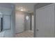 Foyer with white tile, access to kitchen, hall closet, and staircase at 6250 W Flamingo Rd # 7, Las Vegas, NV 89103