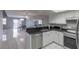 Open-concept kitchen with stainless steel appliances and granite countertops, flowing into the dining area at 6250 W Flamingo Rd # 7, Las Vegas, NV 89103