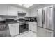 Modern kitchen featuring stainless steel appliances, white cabinetry and a granite countertop at 6250 W Flamingo Rd # 7, Las Vegas, NV 89103