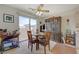 Cozy dining area with sliding glass door provides abundant natural light, seating for four, and outdoor access at 691 Anne Ln # 0, Henderson, NV 89015