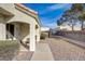 Side view of a lovely home with desert landscaping, a covered porch, and a charming seating area at 691 Anne Ln # 0, Henderson, NV 89015